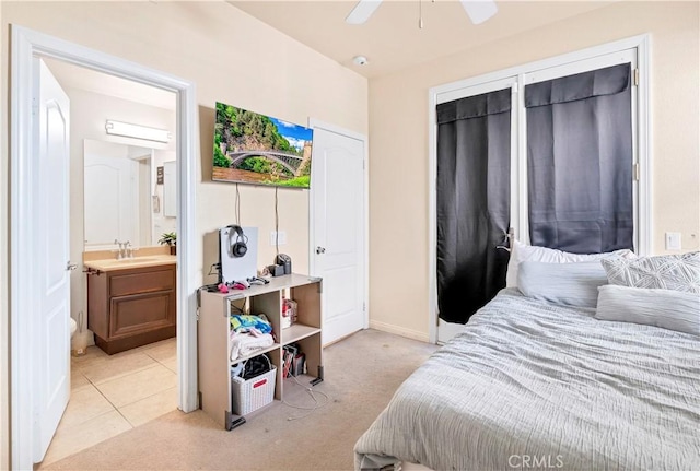 3070 Sand Pine Trl, Hemet, CA 92545 - bedroom featuring ensuite bathroom, a sink, light tile patterned flooring, baseboards, and light colored carpet