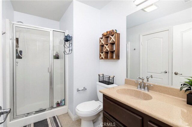 3070 Sand Pine Trl, Hemet, CA 92545 - bathroom featuring visible vents, toilet, a stall shower, tile patterned floors, and vanity
