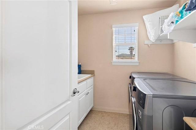 3070 Sand Pine Trl, Hemet, CA 92545 - laundry area featuring baseboards, cabinet space, and independent washer and dryer