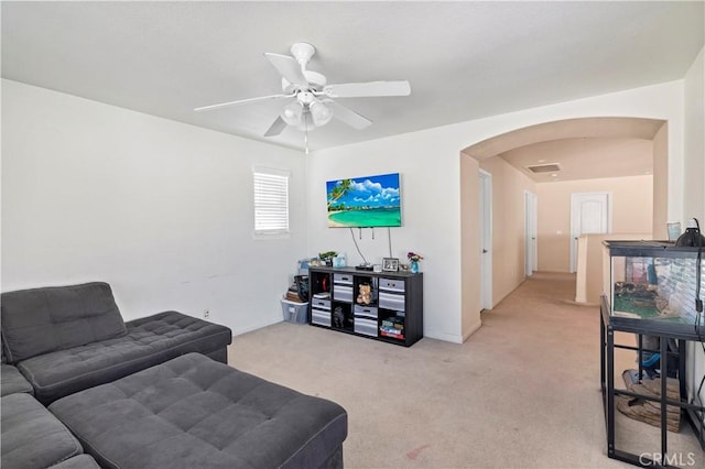 3070 Sand Pine Trl, Hemet, CA 92545 - living room featuring arched walkways, visible vents, light carpet, and ceiling fan
