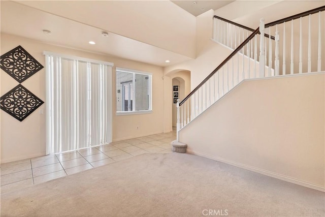 3070 Sand Pine Trl, Hemet, CA 92545 - carpeted entryway featuring tile patterned floors, recessed lighting, stairway, arched walkways, and baseboards