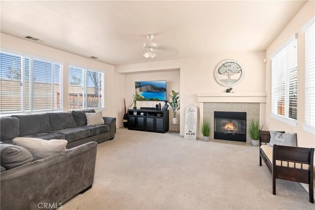 3070 Sand Pine Trl, Hemet, CA 92545 - carpeted living area with visible vents, ceiling fan, and a fireplace