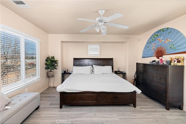 3070 Sand Pine Trl, Hemet, CA 92545 - bedroom featuring light wood finished floors, visible vents, baseboards, and a ceiling fan