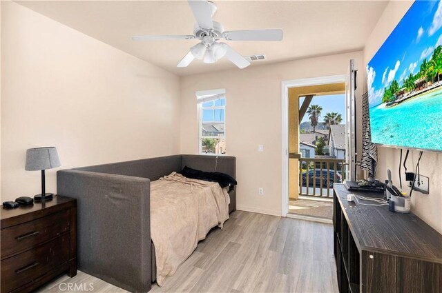 3070 Sand Pine Trl, Hemet, CA 92545 - bedroom featuring visible vents, multiple windows, a ceiling fan, and light wood-style floors