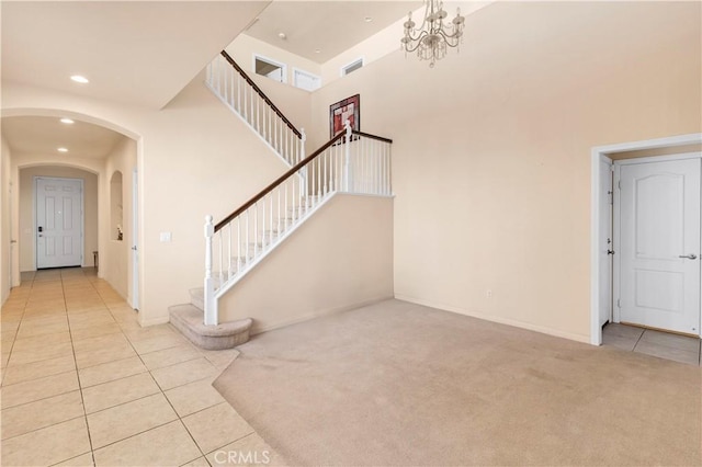3070 Sand Pine Trl, Hemet, CA 92545 - interior space featuring visible vents, recessed lighting, a towering ceiling, tile patterned floors, and carpet flooring