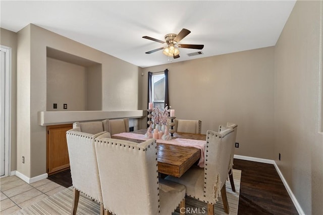 dining area featuring visible vents, baseboards, and ceiling fan