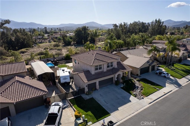 birds eye view of property with a mountain view
