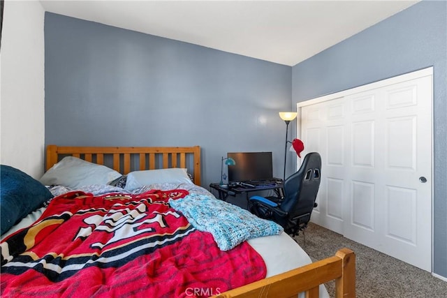 bedroom featuring a closet and carpet flooring