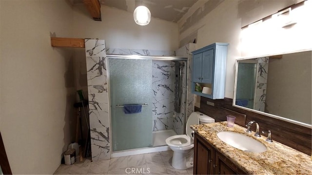 bathroom featuring a marble finish shower, toilet, marble finish floor, and vanity