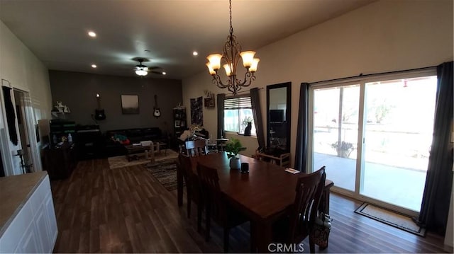 dining space with dark wood finished floors, recessed lighting, and ceiling fan with notable chandelier