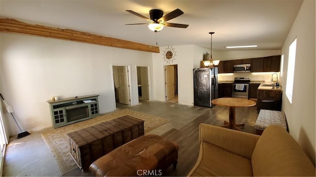 living area with beamed ceiling, light wood finished floors, and ceiling fan with notable chandelier