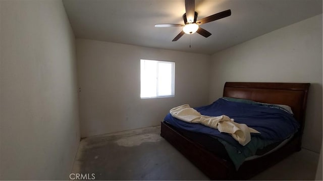 bedroom with unfinished concrete flooring and a ceiling fan