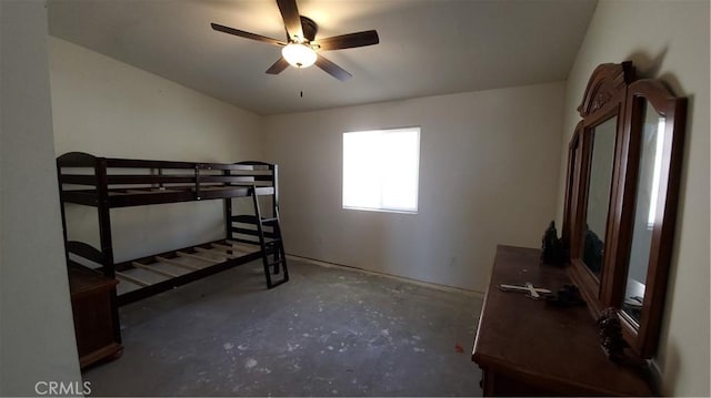 bedroom with ceiling fan and unfinished concrete floors