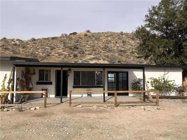back of house with stucco siding