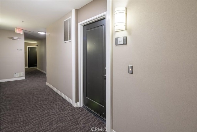 7320 Hawthorn Ave Unit 111, Los Angeles, CA 90046 - hallway featuring dark carpet and baseboards