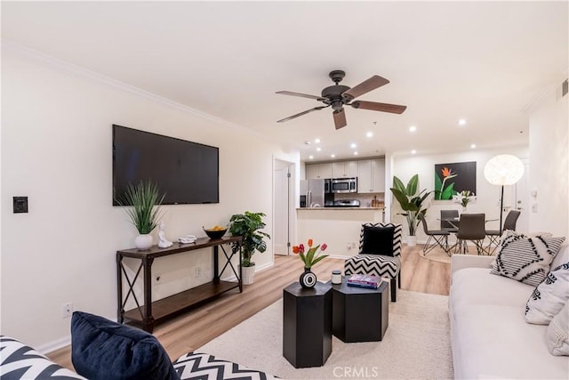 7320 Hawthorn Ave Unit 111, Los Angeles, CA 90046 - living room with light wood-style floors, ceiling fan, recessed lighting, crown molding, and baseboards