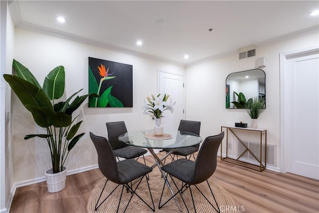 7320 Hawthorn Ave Unit 111, Los Angeles, CA 90046 - dining room featuring wood finished floors, crown molding, baseboards, and recessed lighting