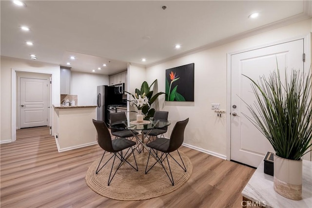 7320 Hawthorn Ave Unit 111, Los Angeles, CA 90046 - dining area featuring light wood-type flooring, baseboards, recessed lighting, and ornamental molding