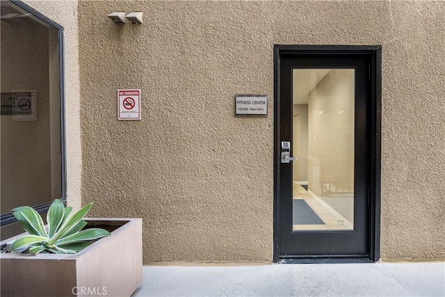 7320 Hawthorn Ave Unit 111, Los Angeles, CA 90046 - doorway to property featuring stucco siding