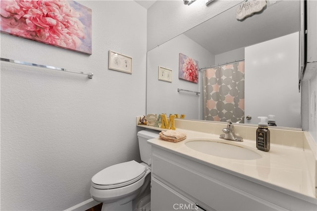 bathroom with a shower with shower curtain, toilet, and vanity