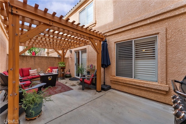 view of patio with a fire pit and a pergola