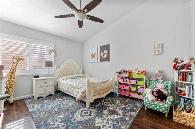 bedroom with lofted ceiling, wood finished floors, baseboards, and ceiling fan