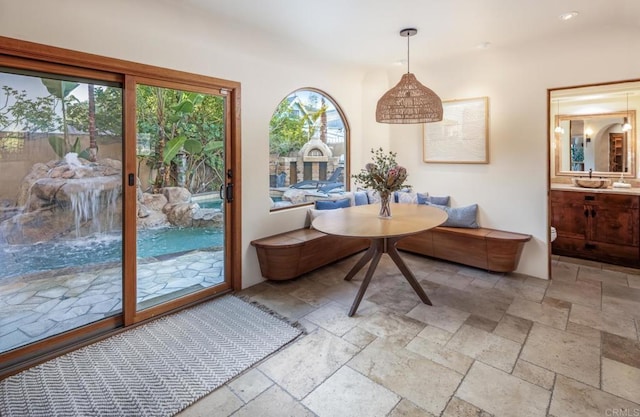 112 La Veta Ave, Encinitas, CA 92024 - dining room with a healthy amount of sunlight and stone tile flooring