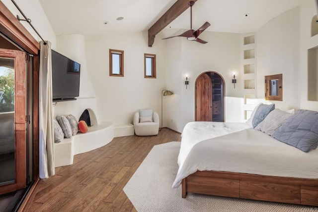 112 La Veta Ave, Encinitas, CA 92024 - bedroom featuring a ceiling fan, wood finished floors, baseboards, vaulted ceiling with beams, and arched walkways