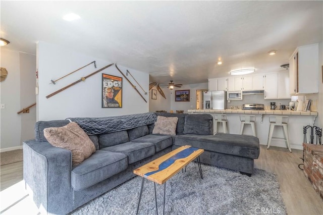 723 Summit Blvd, Big Bear Lake, CA 92315 - living room with baseboards, light wood finished floors, and a ceiling fan