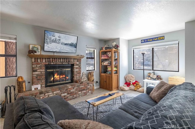 723 Summit Blvd, Big Bear Lake, CA 92315 - living room with a fireplace, wood finished floors, and a textured ceiling