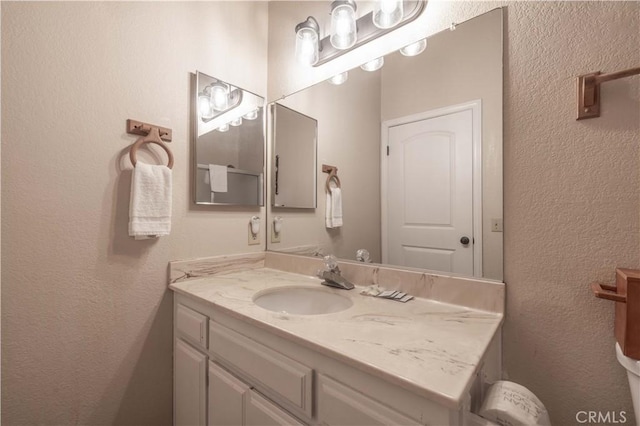 723 Summit Blvd, Big Bear Lake, CA 92315 - bathroom featuring a textured wall and vanity