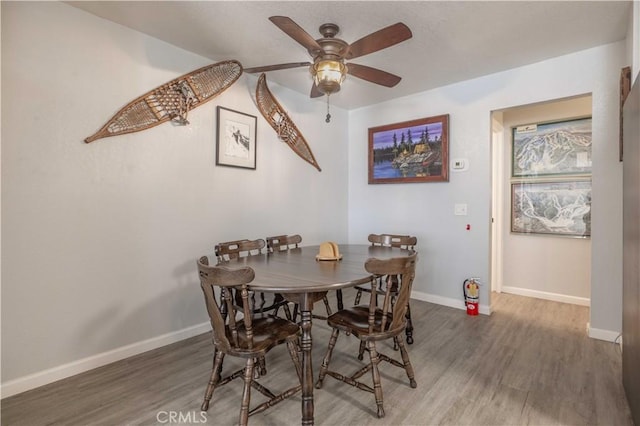 723 Summit Blvd, Big Bear Lake, CA 92315 - dining space with baseboards, wood finished floors, and ceiling fan