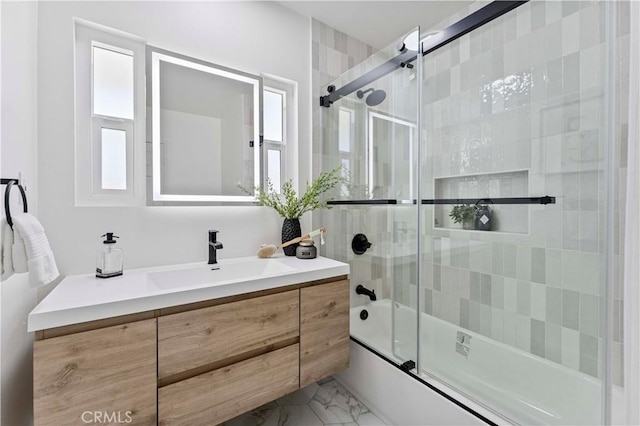 full bathroom with shower / bath combination with glass door, vanity, and marble finish floor