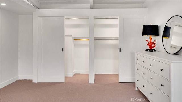 3317 Lees Ave, Long Beach, CA 90808 - unfurnished bedroom featuring light colored carpet, baseboards, and two closets