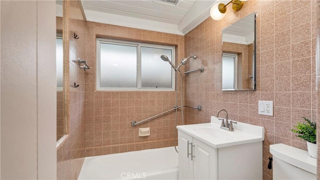 3317 Lees Ave, Long Beach, CA 90808 - bathroom featuring toilet, vanity, and tile walls