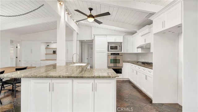 3317 Lees Ave, Long Beach, CA 90808 - kitchen with stainless steel appliances, under cabinet range hood, a sink, dark stone finish floors, and ceiling fan