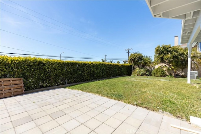 exterior space with fence and central AC