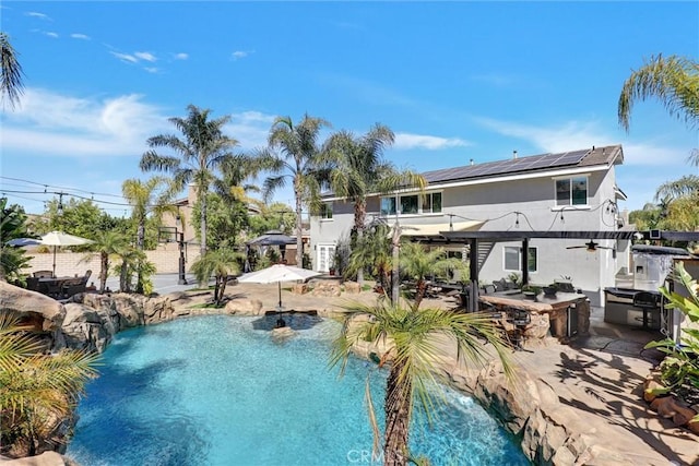 1610 Via Roma Cir, Corona, CA 92881 - outdoor pool featuring exterior kitchen, an outdoor bar, a patio, and a ceiling fan