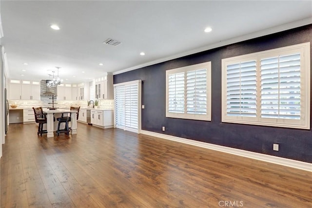 1610 Via Roma Cir, Corona, CA 92881 - living area with recessed lighting, dark wood finished floors, an inviting chandelier, visible vents, and baseboards