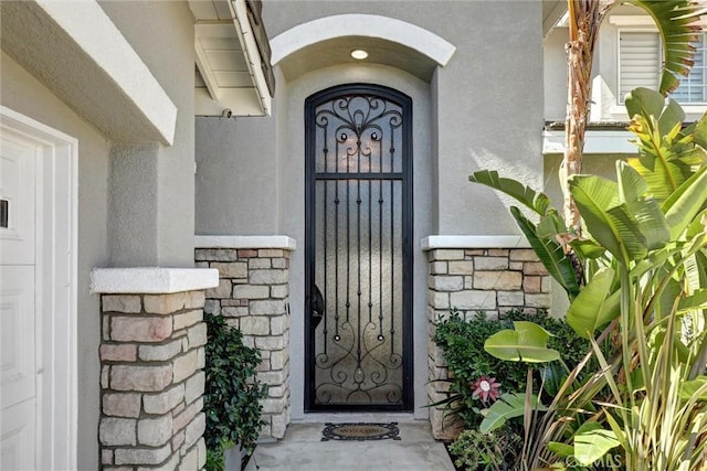 1610 Via Roma Cir, Corona, CA 92881 - doorway to property featuring stucco siding and stone siding