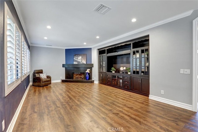 1610 Via Roma Cir, Corona, CA 92881 - living room with ornamental molding, wood finished floors, recessed lighting, and a fireplace with raised hearth