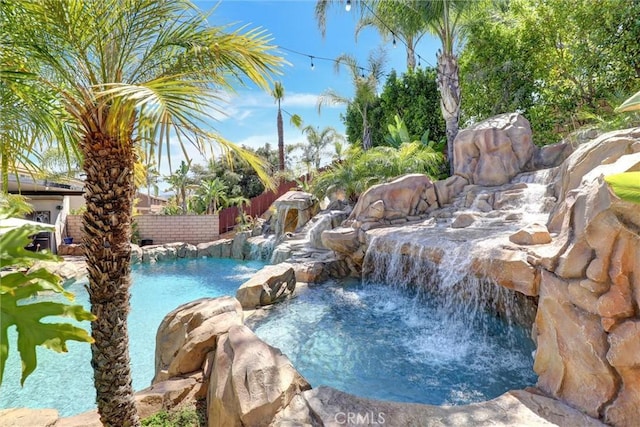 1610 Via Roma Cir, Corona, CA 92881 - view of swimming pool featuring fence, a hot tub, and a fenced in pool