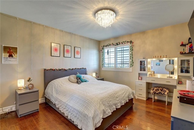 1610 Via Roma Cir, Corona, CA 92881 - bedroom with wood finished floors, baseboards, and an inviting chandelier