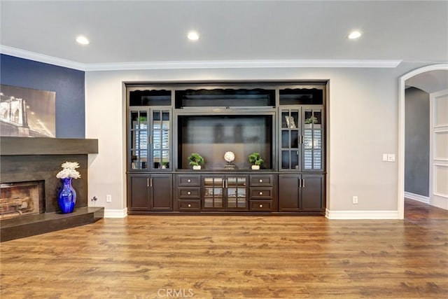 1610 Via Roma Cir, Corona, CA 92881 - bar featuring arched walkways, crown molding, wood finished floors, and baseboards