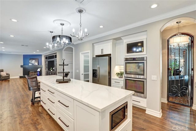 1610 Via Roma Cir, Corona, CA 92881 - kitchen featuring open floor plan, a chandelier, stainless steel appliances, white cabinetry, and recessed lighting