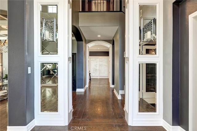 1610 Via Roma Cir, Corona, CA 92881 - hallway with arched walkways and dark wood-style flooring