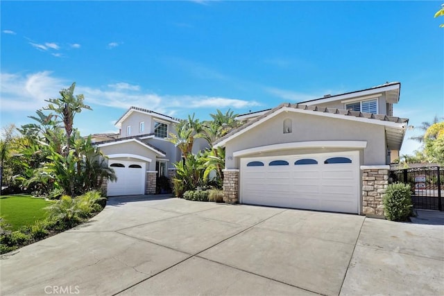 1610 Via Roma Cir, Corona, CA 92881 - view of front of house with stucco siding, stone siding, and concrete driveway