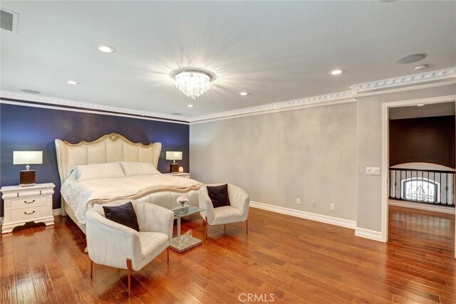 1610 Via Roma Cir, Corona, CA 92881 - bedroom featuring visible vents, baseboards, a chandelier, wood finished floors, and crown molding
