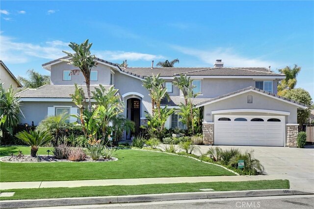 1610 Via Roma Cir, Corona, CA 92881 - view of front facade featuring a garage, concrete driveway, a chimney, a front yard, and stucco siding