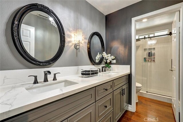 1610 Via Roma Cir, Corona, CA 92881 - full bathroom with double vanity, wood finished floors, and a stall shower